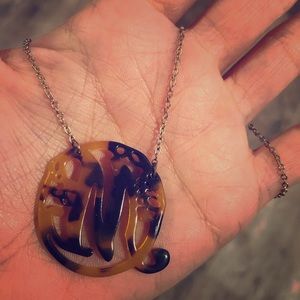 Initial M tortoise shell like design necklace